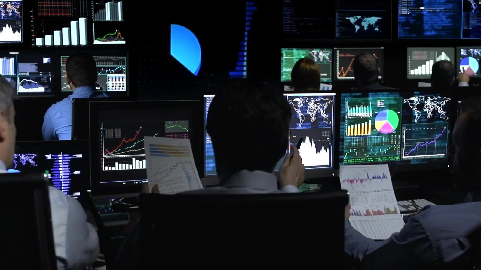 Representative project team reviewing connected business dashboards