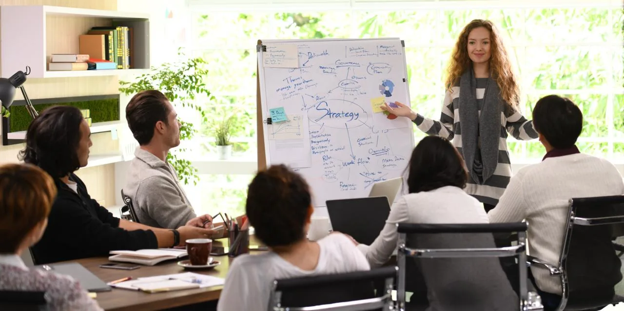Representative colleagues sharing ideas in a strategy workshop